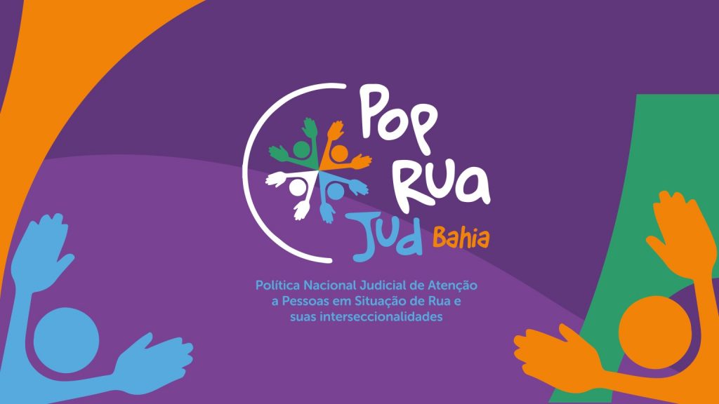 Arte de divulgação do Pop Rua Jud Bahia, com fundo roxo, figuras humanas coloridas e referência à política judicial de atenção a pessoas em situação de rua.